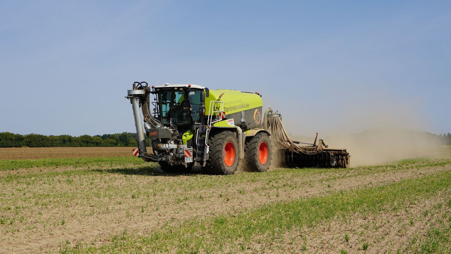 Modern farming machinery working in a field in Geesthacht, capturing agricultural technology in action.
